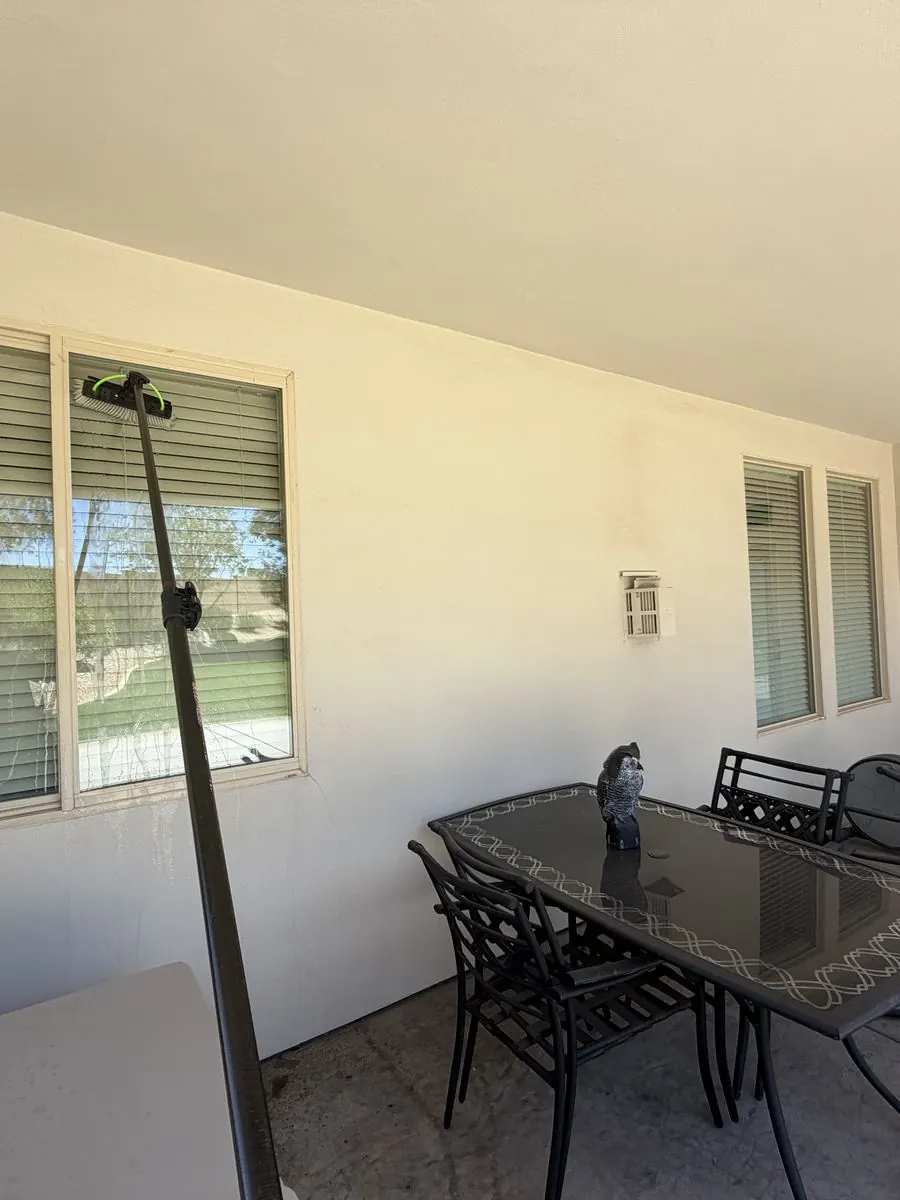 Covered patio window cleaned, mountain view through the glass