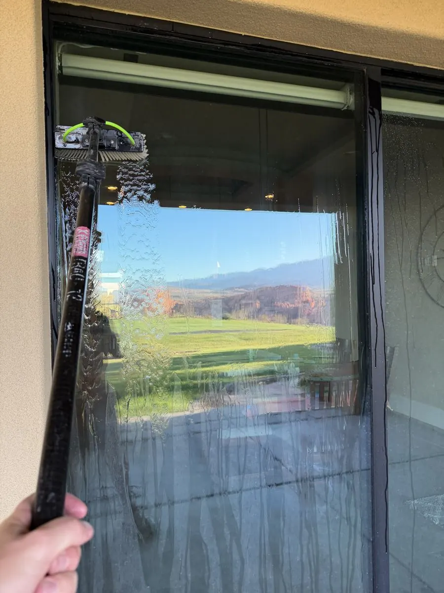 Window cleaned, red rock reflection in the glass