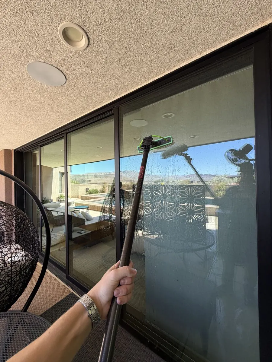 Patio cover window cleaned, furniture reflected in the glass
