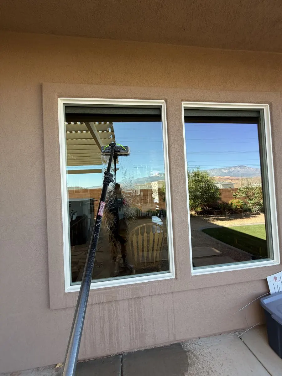 Window cleaned near a patio railing
